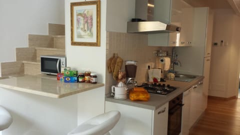 Apartment, 3 Bedrooms | Private kitchen | Full-size fridge, microwave, oven, stovetop