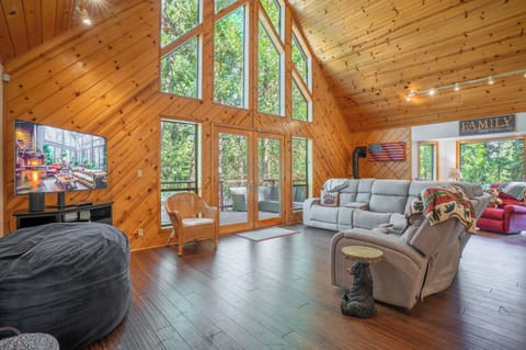 Huge windows looking out over the pine forest.