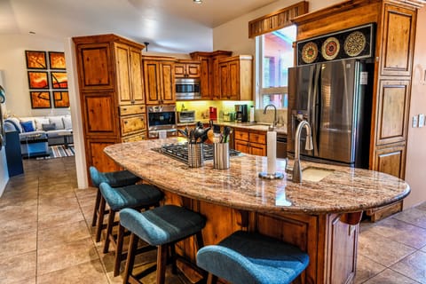 Chef kitchen with bar seating for 4