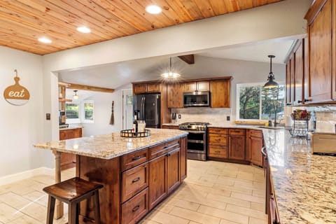 Fully stocked kitchen with modern appliances and amenities.