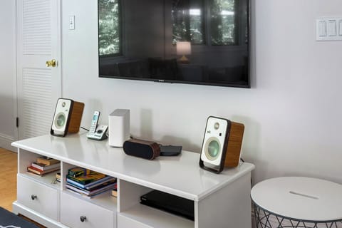 Living room flat screen TV and sound system.