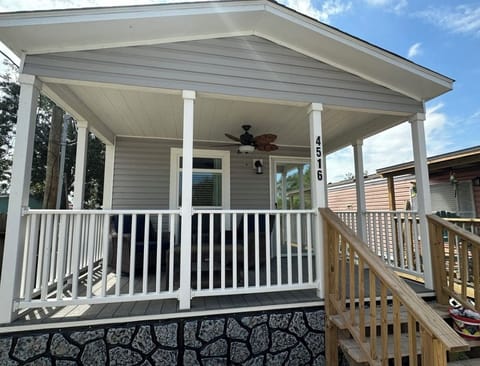Front of the house featuring front porch with outdoor seating.