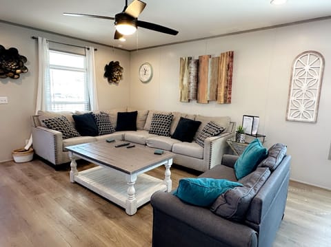 L shape living room plus sofa bed.