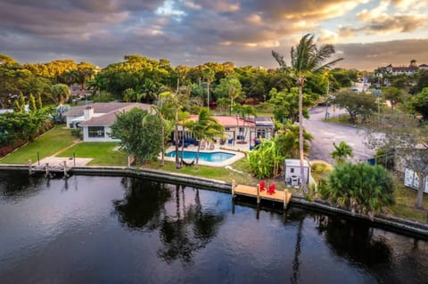 Take in the stunning aerial view of this waterfront property, complete with a sparkling pool and breathtaking views, offering the ultimate in relaxation and scenic beauty.