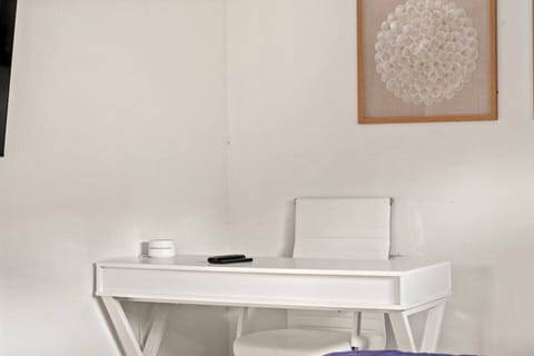 Set up for work or leisure at this sleek and functional desk, providing a comfortable space for productivity or planning your next adventure.