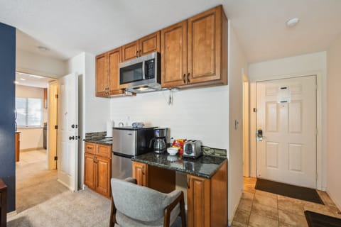 Has a mini fridge and freezer, microwave, coffee pot, and toaster.