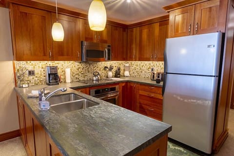 Deluxe Condo, 1 Bedroom, Non Smoking (1 Bath) | Private kitchen | Full-size fridge, microwave, oven, stovetop