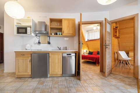 Family Apartment, 3 Bedrooms, Balcony | Private kitchenette | Fridge, stovetop, electric kettle, cookware/dishes/utensils