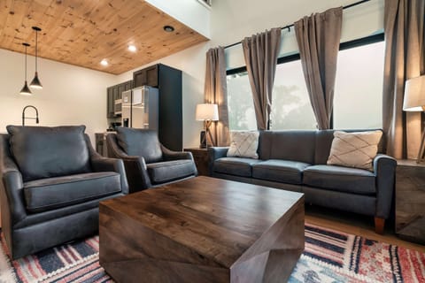 Stylish seating and vibrant decor invite relaxation and fun gatherings. Enjoy!