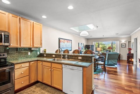 Open-concept living, dining, and kitchen area.