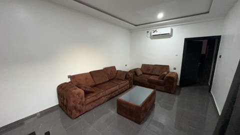 Deluxe Suite, City View | Living area | TV