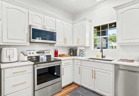 With plenty of counter space, stainless steel appliances, and charming touches, this kitchen is designed for creating delicious meals while enjoying time together.