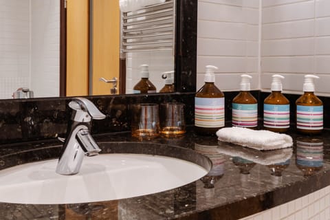 Designer toiletries, hair dryer, towels, soap