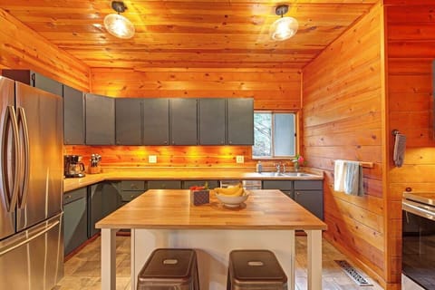 A fully stocked kitchen with bar seating and everything you need to prepare delicious meals.