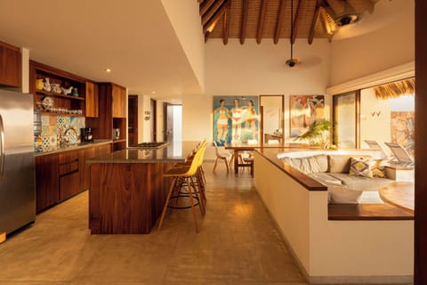 Enjoy meals with a backdrop of the ocean in this beautifully designed dining space with natural lighting.