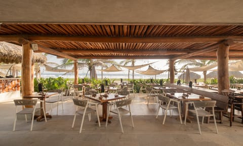 Dine and unwind at this beachfront restaurant, offering delicious meals with breathtaking panoramic ocean views.
