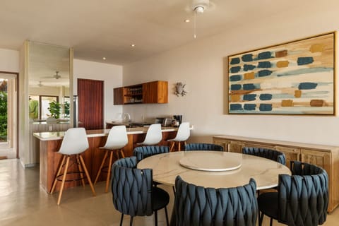 Dine in this chic, open-concept space, featuring modern furniture, natural light, and ocean-inspired decor.
