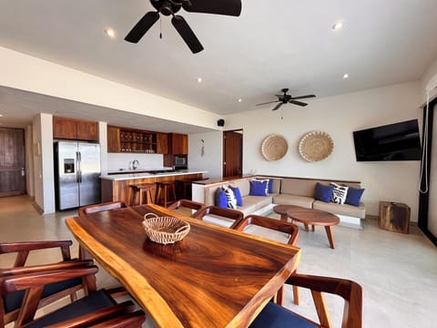 A beautifully designed dining and living area, perfect for gatherings with breathtaking beachfront views.