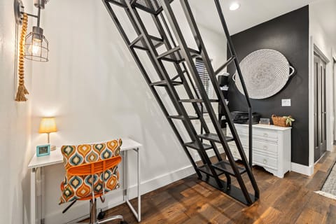 The stairs leading to the upstairs loft.