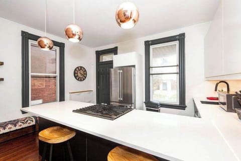 The sleek, open kitchen offers ample space & every home comfort