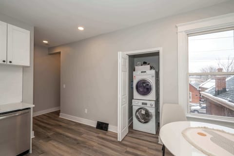 A tidy laundry closet hides the private washer & dryer in the kitchen