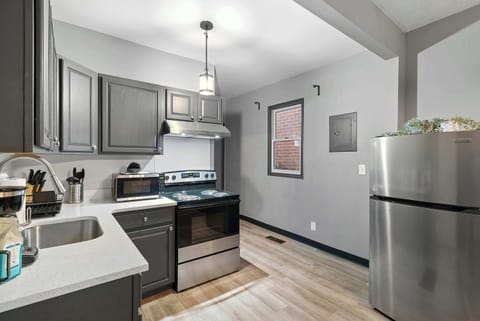 The chic, open kitchen offers ample space & every home comfort