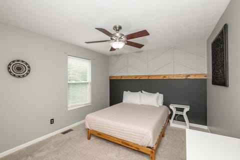 The final chic bedroom features a queen-sized bed