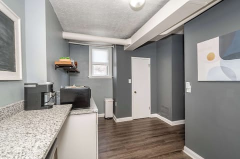 The streamlined kitchenette is well-equipped for your visit