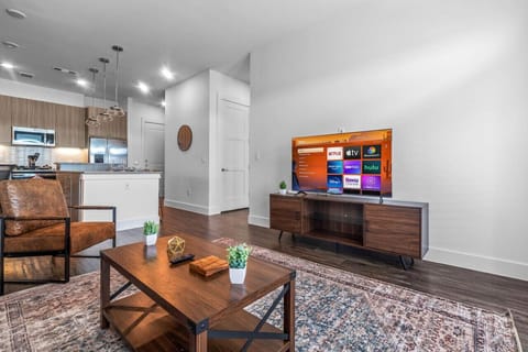 The living room is filled with natural light, creating a bright and welcoming space that invites relaxation.