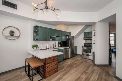 The elegant kitchen offers ample space & all the comforts of home