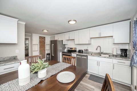 The bright, cozy kitchen offers ample space & all the comforts of home