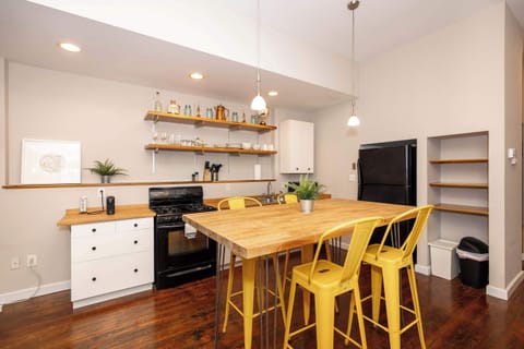The chic eat-in kitchen offers ample space & all the comforts of home