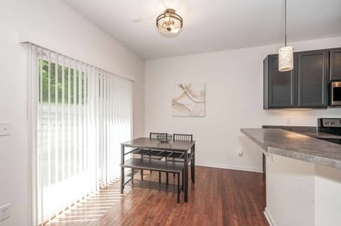 The kitchen table offers seating for 4