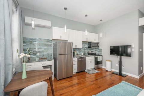 Suite 2’s sleek, fully equipped kitchen offers every comfort of home