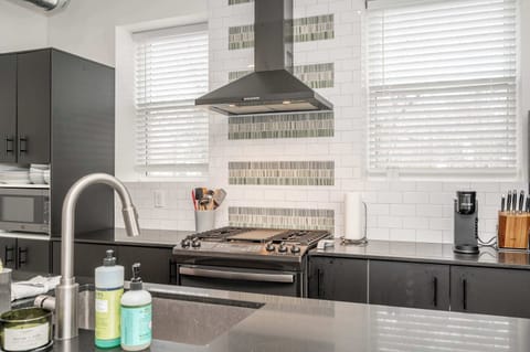 The sophisticated kitchen offers ample space & all the comforts of home