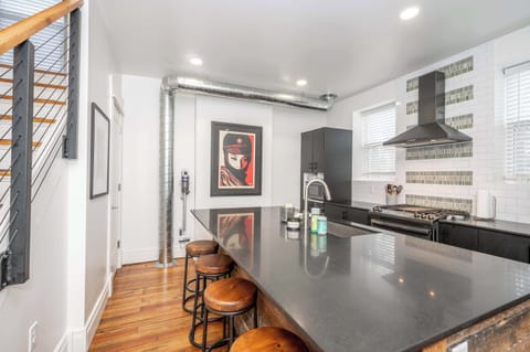 The sophisticated kitchen offers ample space & all the comforts of home