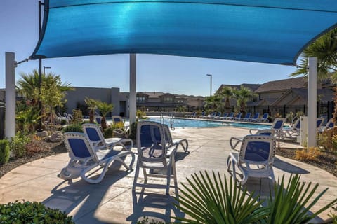 Come relax by the pool, only yards away from our front door!