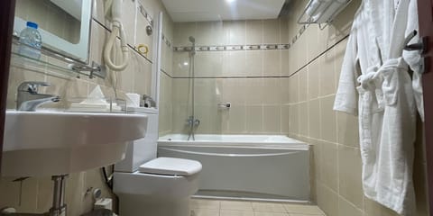 Junior Suite, Balcony, City View | Bathroom | Combined shower/tub, hair dryer, soap, shampoo