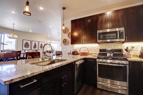 Open concept kitchen looking out to dining and living area.