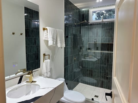 Junior Room, Garden View | Bathroom | Shower, hair dryer, towels, soap