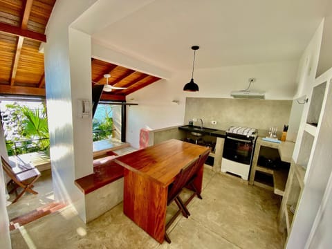 Villa | Private kitchen | Fridge, microwave, toaster, cookware/dishes/utensils