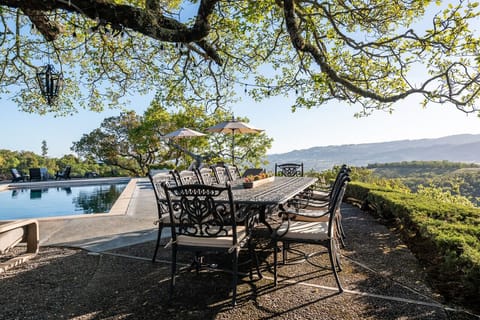 This outdoor dining area is a perfect way to end a day in the pool!