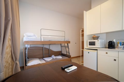 Family Quadruple Room | Minibar, iron/ironing board, free WiFi
