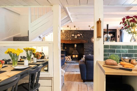 Kitchen and dining area with table and chairs, view of lounge