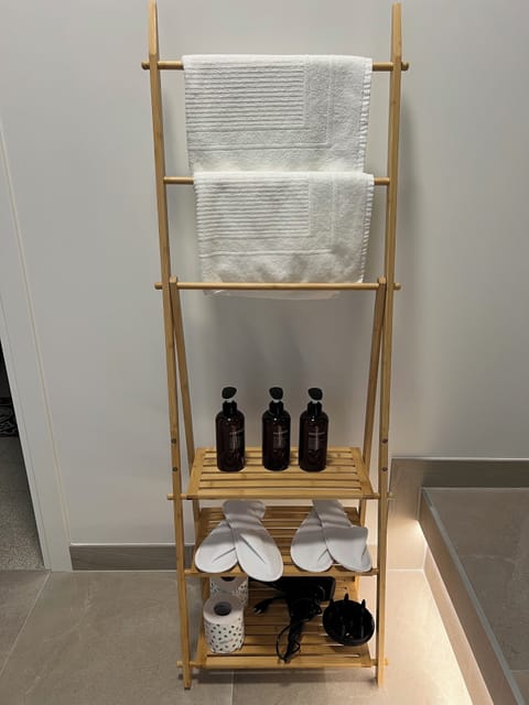 Comfort Studio Suite, 1 King Bed, City View | Bathroom | Shower, hair dryer, slippers, towels