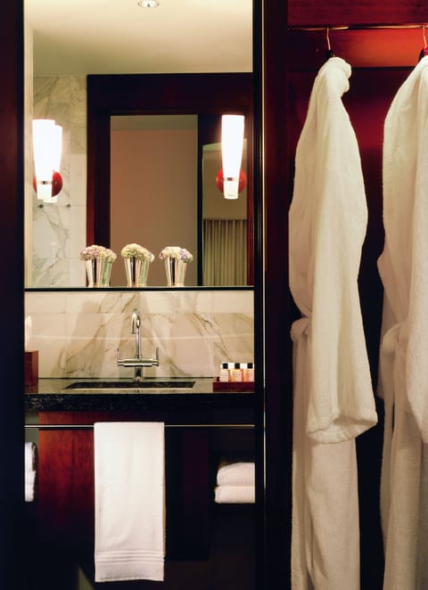 Separate tub and shower, designer toiletries, hair dryer, bathrobes