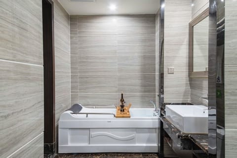 Signature Room | Bathroom | Separate tub and shower, hair dryer, towels, soap