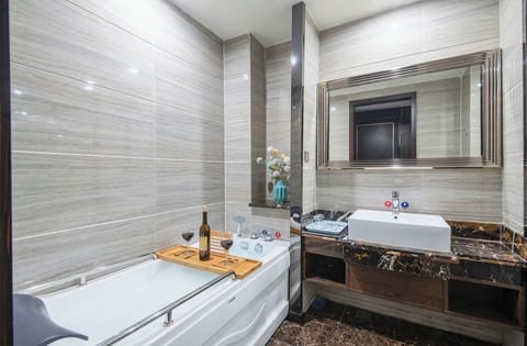 Signature Room | Bathroom | Separate tub and shower, hair dryer, towels, soap