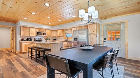 Open kitchen and dining space with warm wooden tones and plenty of light.