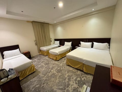 Deluxe Quadruple Room, City View | In-room safe, free WiFi